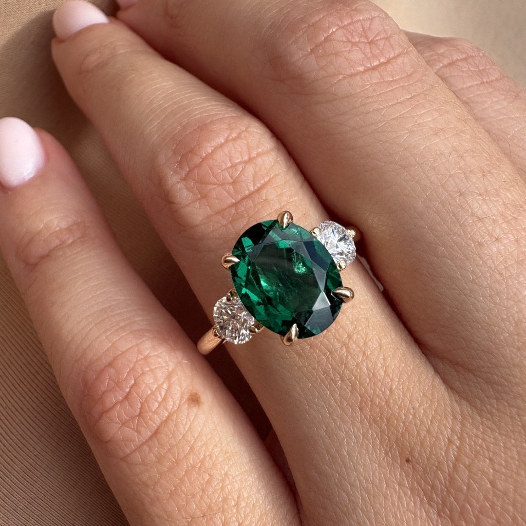 Oval Emerald Three Stone Engagement Ring